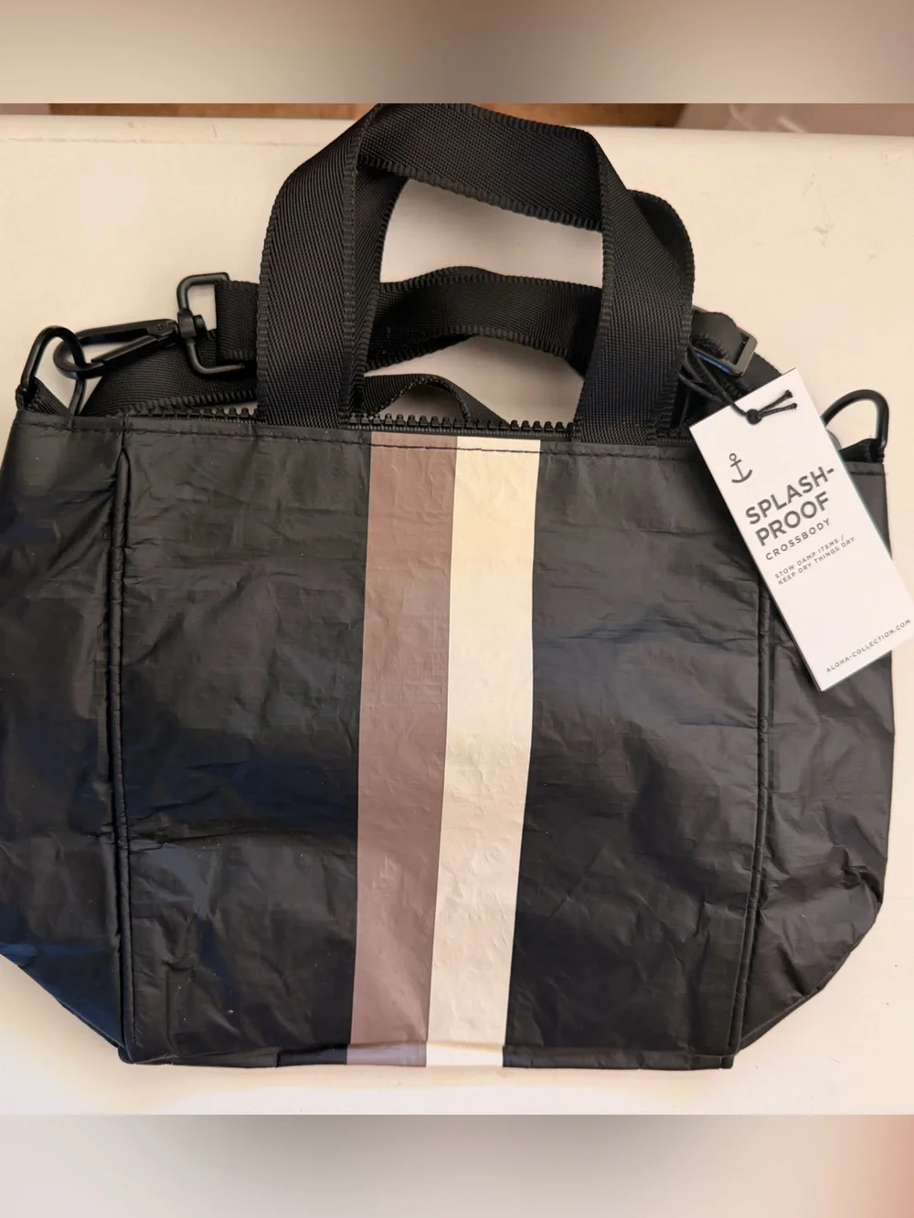 Aloha Collection Black Crossbody Bag with Neutral Stripes